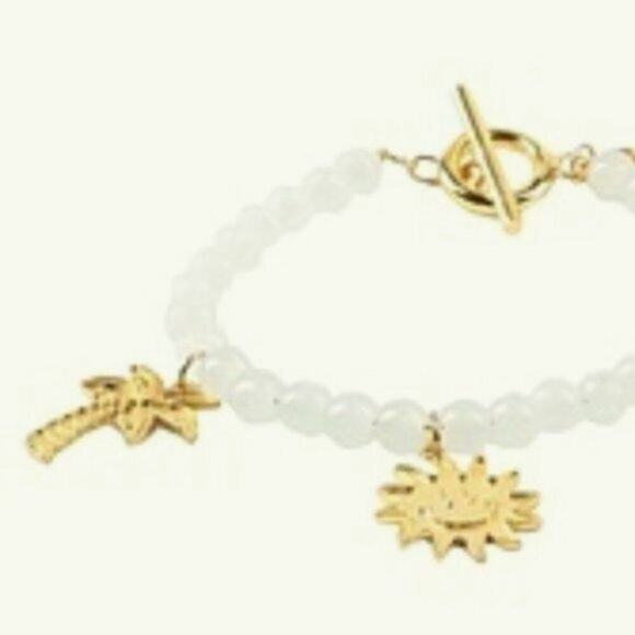 Ganni White beaded bracelet with gold charms
